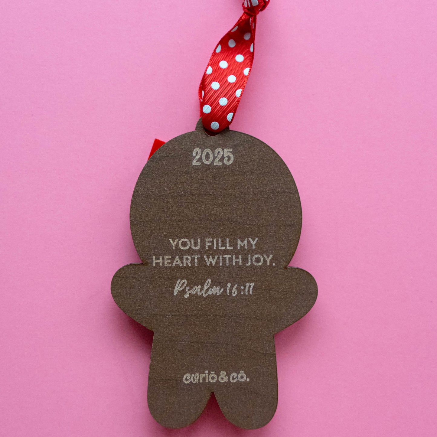 Back of gingerbread ornament with the year and bible verse Psalm 16:11