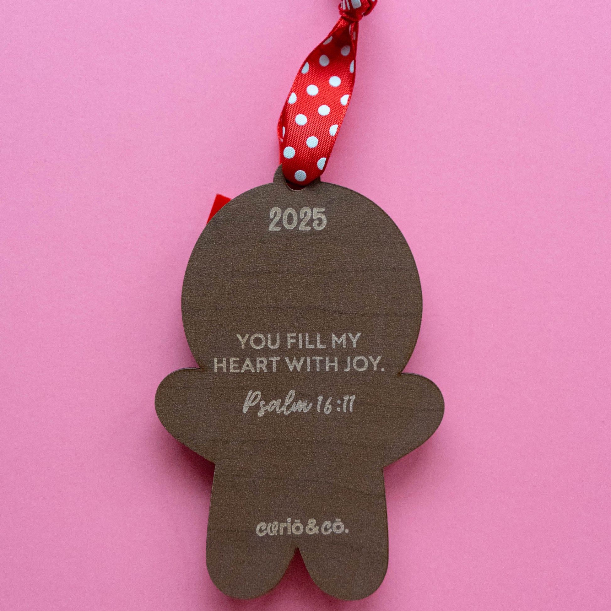Back of gingerbread ornament with the year and bible verse Psalm 16:11